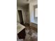 Bright bathroom featuring a combination tub/shower, neutral-toned walls, and a vanity with a sink at 1562 Onalee Dr, Hampton, GA 30228