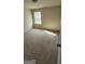 Bedroom with carpeted flooring, and a window at 1562 Onalee Dr, Hampton, GA 30228