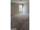 Bedroom with carpeted flooring, and a window providing natural light at 1562 Onalee Dr, Hampton, GA 30228