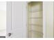 An open closet features wire shelving for optimal storage in a neutral-toned room at 1562 Onalee Dr, Hampton, GA 30228