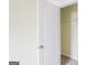 An open closet features wire shelving for optimal storage in a neutral-toned room at 1562 Onalee Dr, Hampton, GA 30228