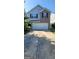 Two-story home with a brick facade, blue siding, and a two-car garage at 1562 Onalee Dr, Hampton, GA 30228