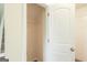 Linen closet at the top of the stairs offers a storage solution at 1562 Onalee Dr, Hampton, GA 30228