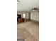 An open-concept living room and kitchen area with carpet and vinyl flooring plus a ceiling fan at 1562 Onalee Dr, Hampton, GA 30228