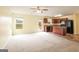 Open-concept living space combines the kitchen and living area with abundant natural light at 1562 Onalee Dr, Hampton, GA 30228