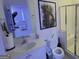 Modern bathroom with shower, sleek fixtures, decorative art, and integrated sink at 2282 Mclean Chase Se, Smyrna, GA 30080
