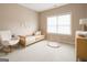 Neutral Bedroom with sleek rocking chair, wood crib, modern decor, and carpeted floors at 2282 Mclean Chase Se, Smyrna, GA 30080