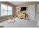 Neutral Bedroom showcases a changing table, adjacent to a window and a baby play gym at 2282 Mclean Chase Se, Smyrna, GA 30080