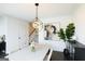 Dining room features modern light fixture, abstract art, and sleek furniture at 2282 Mclean Chase Se, Smyrna, GA 30080