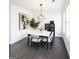 Modern dining room with stylish lighting, decor, and a table with seating for six at 2282 Mclean Chase Se, Smyrna, GA 30080