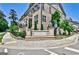 Attractive brick townhome featuring professionally landscaped grounds and manicured shrubbery at 2282 Mclean Chase Se, Smyrna, GA 30080