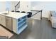 Kitchen island with a stainless steel dishwasher, barstool seating, and an undermount sink at 2282 Mclean Chase Se, Smyrna, GA 30080