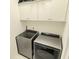 Laundry room featuring a modern washer and dryer set with white cabinets above at 2282 Mclean Chase Se, Smyrna, GA 30080