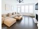 Bright living room featuring a fireplace, plush sectional sofa, and large windows providing lots of natural light at 2282 Mclean Chase Se, Smyrna, GA 30080