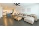 Spacious living room with a large sofa, kitchen view, and staircase access at 2282 Mclean Chase Se, Smyrna, GA 30080