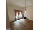 A minimalistic bedroom featuring a window with pink curtains and carpeted flooring at 1085 Pleasant Hill Nw Rd, Conyers, GA 30012
