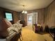 Unfurnished room with unique wood paneling and view into adjacent room at 1085 Pleasant Hill Nw Rd, Conyers, GA 30012