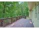 Spacious wooden deck overlooking a private backyard with mature trees, perfect for outdoor entertaining at 765 Brooks Cir, Stone Mountain, GA 30087