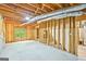 Unfinished basement space with exposed wood framing and ductwork, ready for customization and expansion at 765 Brooks Cir, Stone Mountain, GA 30087