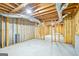 Spacious unfinished basement area featuring exposed utilities and wood framing, offering potential for future renovation at 765 Brooks Cir, Stone Mountain, GA 30087