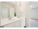 Bright bathroom featuring a double sink vanity, large mirror, and neutral paint at 765 Brooks Cir, Stone Mountain, GA 30087