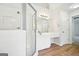 Large bright bathroom featuring a glass shower, vanity and modern fixtures at 765 Brooks Cir, Stone Mountain, GA 30087