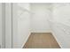 Walk-in closet with wire shelving and carpet flooring at 765 Brooks Cir, Stone Mountain, GA 30087