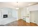 Dining area with hardwood floors, fireplace, and built-in desk at 765 Brooks Cir, Stone Mountain, GA 30087