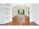 Bright dining room featuring hardwood floors, large windows, and built-in shelving at 765 Brooks Cir, Stone Mountain, GA 30087
