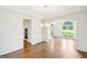 Formal dining room with hardwood floors, an arched doorway, and white trim at 765 Brooks Cir, Stone Mountain, GA 30087