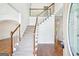 Inviting foyer with hardwood floors, staircase, and bright, neutral tones at 765 Brooks Cir, Stone Mountain, GA 30087