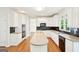 Bright kitchen with white cabinets, granite countertops, and stainless steel appliances at 765 Brooks Cir, Stone Mountain, GA 30087