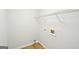 Bright laundry room with white walls, wood look flooring, and utility hookups at 765 Brooks Cir, Stone Mountain, GA 30087
