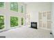 Bright living room with tall windows, fireplace, and built-in shelving at 765 Brooks Cir, Stone Mountain, GA 30087
