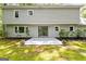 View of the home's backyard featuring a patio and lush landscaping at 335 Cedar Ln, Fayetteville, GA 30214
