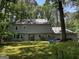 Expansive backyard with lush green lawn, perfect for outdoor activities and enjoying nature at 335 Cedar Ln, Fayetteville, GA 30214