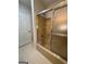 Bathroom featuring a shower with sliding door, toilet, and tile floor at 335 Cedar Ln, Fayetteville, GA 30214