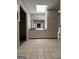 Bright bathroom with a double vanity, linen closet, and tiled floors at 335 Cedar Ln, Fayetteville, GA 30214
