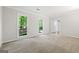 Spacious bedroom with plush carpet and multiple windows at 335 Cedar Ln, Fayetteville, GA 30214
