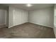 Carpeted bedroom with a large closet at 335 Cedar Ln, Fayetteville, GA 30214