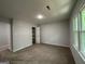 Spacious bedroom with carpet and large closet at 335 Cedar Ln, Fayetteville, GA 30214