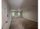 Spacious bedroom with two windows and a ceiling fan at 335 Cedar Ln, Fayetteville, GA 30214