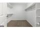 Walk-in closet features ample shelving and hanging space for optimal storage at 335 Cedar Ln, Fayetteville, GA 30214