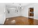 Dining room with parquet floors, updated lighting, and ample room for entertaining at 335 Cedar Ln, Fayetteville, GA 30214