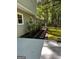 Home exterior features a walkway, privacy fence, and lush greenery, enhancing outdoor appeal at 335 Cedar Ln, Fayetteville, GA 30214