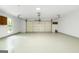 Bright garage features plenty of space with a large garage door and a side window at 335 Cedar Ln, Fayetteville, GA 30214