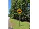 A road sign indicating golf cart crossing or golf cart access is available in the community at 335 Cedar Ln, Fayetteville, GA 30214
