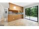 The kitchen flows to a back patio with sliding glass doors that bring the outdoors in at 335 Cedar Ln, Fayetteville, GA 30214