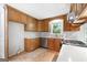 Updated kitchen features granite countertops, stainless appliances, and ample storage at 335 Cedar Ln, Fayetteville, GA 30214