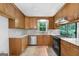 This spacious kitchen boasts sleek countertops, stainless steel appliances, and ample cabinet storage at 335 Cedar Ln, Fayetteville, GA 30214